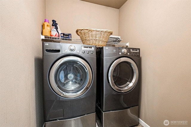 7726 162nd St E, Puyallup, WA 98375 - laundry room featuring separate washer and dryer and baseboards