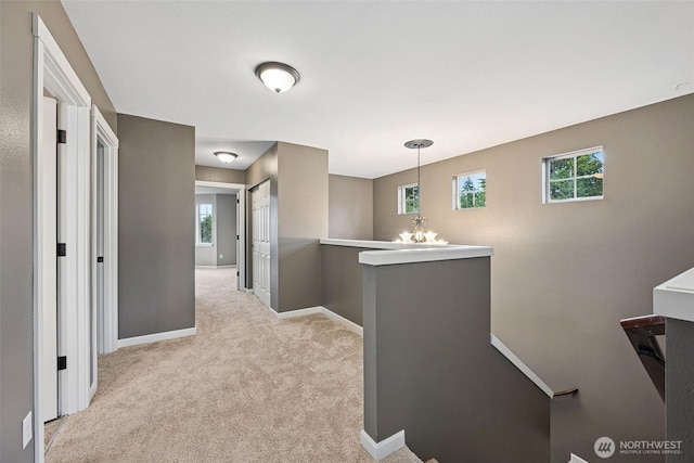 7726 162nd St E, Puyallup, WA 98375 - corridor featuring an upstairs landing, carpet flooring, and healthy amount of natural light