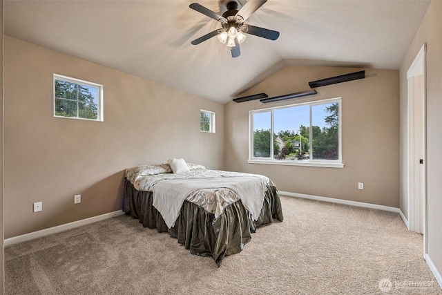 7726 162nd St E, Puyallup, WA 98375 - carpeted bedroom featuring multiple windows, vaulted ceiling, and a ceiling fan