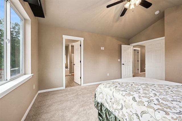 7726 162nd St E, Puyallup, WA 98375 - bedroom with light colored carpet, a ceiling fan, vaulted ceiling, and connected bathroom