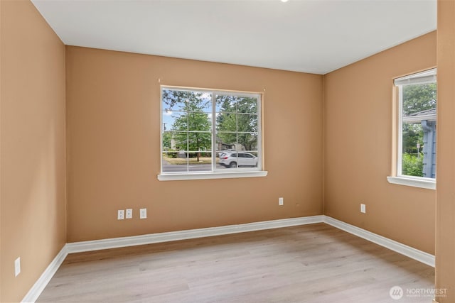 2132 Washington Way, Longview, WA 98632 - empty room featuring wood finished floors and healthy amount of natural light