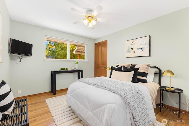 132 NE 130th St, Seattle, WA 98125 - bedroom with light wood-style floors and ceiling fan