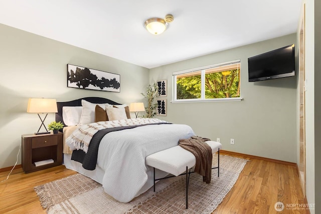 132 NE 130th St, Seattle, WA 98125 - bedroom featuring wood finished floors and baseboards