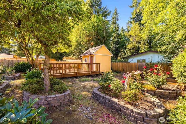 132 NE 130th St, Seattle, WA 98125 - fenced backyard featuring a deck and a storage shed