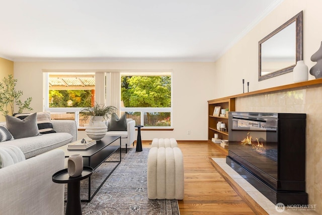 132 NE 130th St, Seattle, WA 98125 - living area featuring healthy amount of natural light, wood finished floors, crown molding, and a tiled fireplace