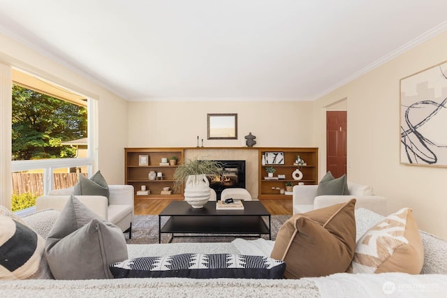132 NE 130th St, Seattle, WA 98125 - living room with wood finished floors, ornamental molding, and a glass covered fireplace