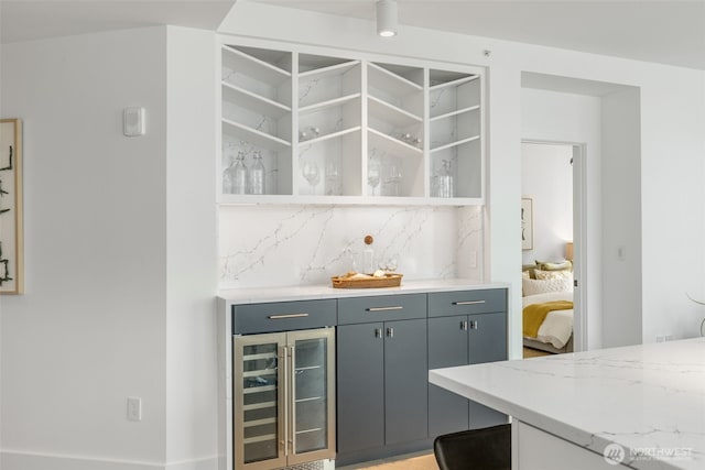 2033 2nd Ave Unit 1111, Seattle, WA 98121 - indoor dry bar featuring wine cooler and tasteful backsplash