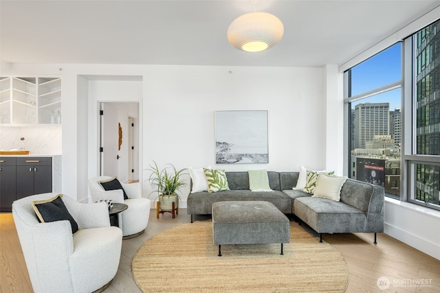 2033 2nd Ave Unit 1111, Seattle, WA 98121 - living room featuring light wood-style flooring and baseboards