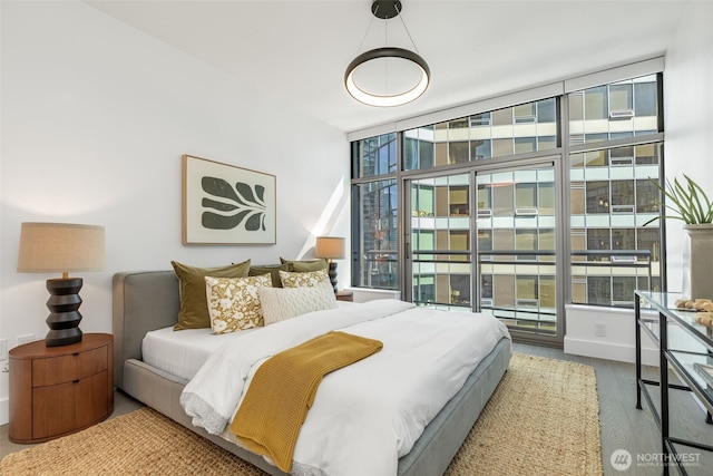 2033 2nd Ave Unit 1111, Seattle, WA 98121 - bedroom with wood finished floors and baseboards