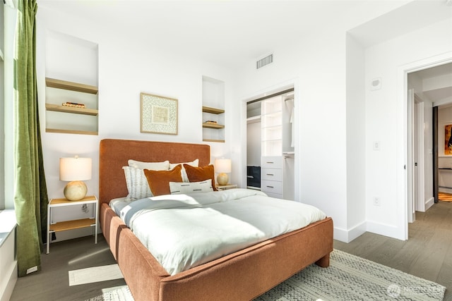 2033 2nd Ave Unit 1111, Seattle, WA 98121 - bedroom with wood finished floors and a spacious closet