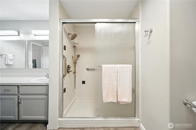 2322 Garrison St, Walla Walla, WA 99362 - full bath featuring a stall shower, vanity, and wood finished floors