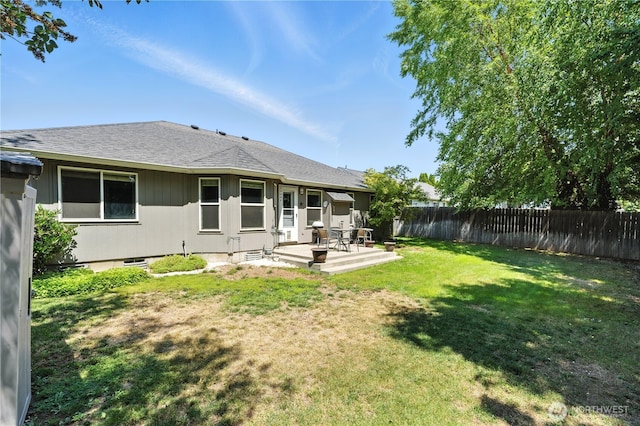 2322 Garrison St, Walla Walla, WA 99362 - rear view of property featuring a fenced backyard, roof with shingles, and a patio area