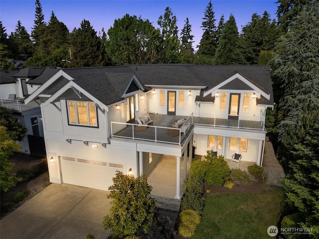 1416 2nd St, Kirkland, WA 98033 - view of front of home featuring a balcony, driveway, a garage, and a shingled roof