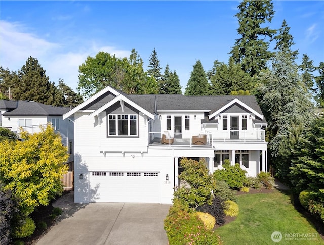 1416 2nd St, Kirkland, WA 98033 - view of front of home featuring a balcony, an attached garage, and concrete driveway