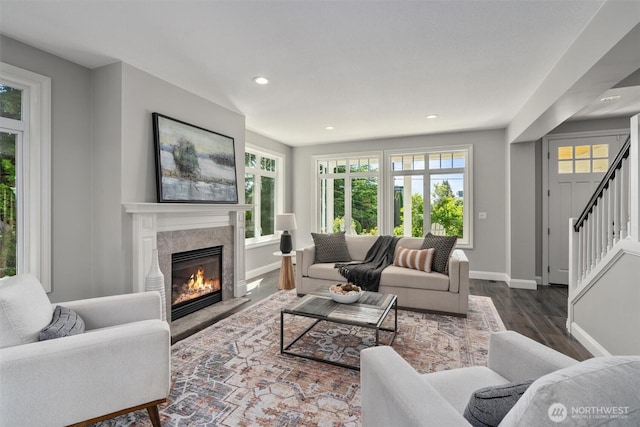 1416 2nd St, Kirkland, WA 98033 - living room with dark wood-style flooring, plenty of natural light, a fireplace, stairs, and recessed lighting