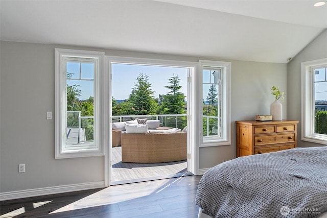1416 2nd St, Kirkland, WA 98033 - bedroom featuring wood finished floors, multiple windows, and vaulted ceiling
