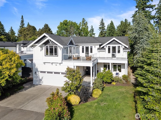 1416 2nd St, Kirkland, WA 98033 - view of front of property with a garage, driveway, a balcony, and a front lawn