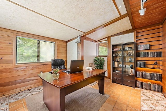 7523 13th Ave SE, Lacey, WA 98503 - office space featuring lofted ceiling, tile patterned flooring, wood walls, and a textured ceiling