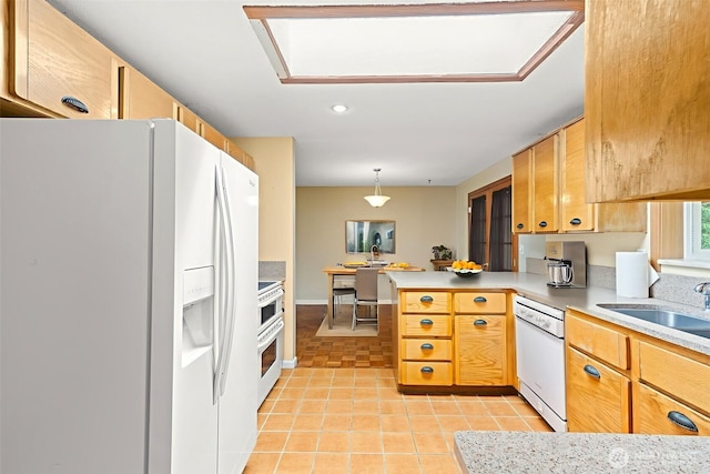 7523 13th Ave SE, Lacey, WA 98503 - kitchen with white appliances, a peninsula, light tile patterned floors, light countertops, and hanging light fixtures
