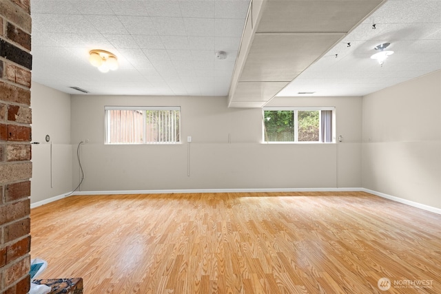 7523 13th Ave SE, Lacey, WA 98503 - unfurnished room with wood finished floors and baseboards