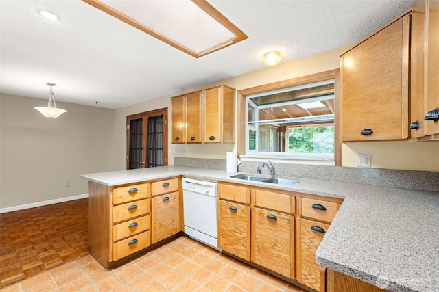 7523 13th Ave SE, Lacey, WA 98503 - kitchen with white dishwasher, a peninsula, light countertops, and hanging light fixtures