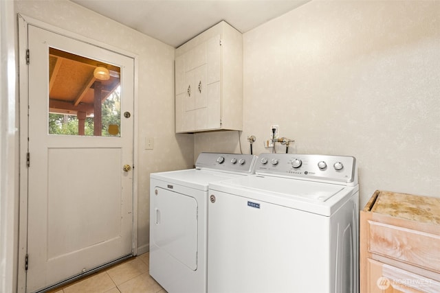 7523 13th Ave SE, Lacey, WA 98503 - washroom featuring independent washer and dryer, light tile patterned floors, and cabinet space