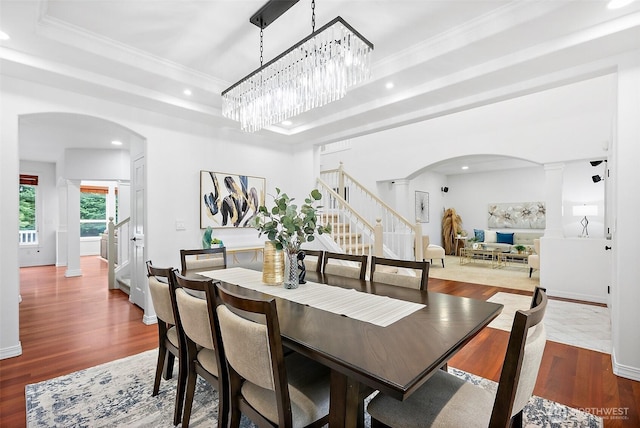 1402 180th Ave E, Lake Tapps, WA 98391 - dining space featuring arched walkways, stairs, recessed lighting, ornamental molding, and a tray ceiling
