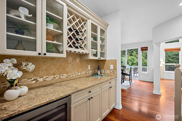 1402 180th Ave E, Lake Tapps, WA 98391 - indoor dry bar with dark wood finished floors, backsplash, and wine cooler