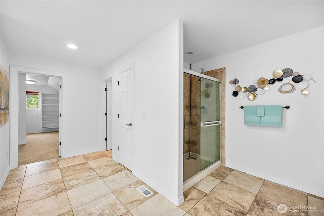1402 180th Ave E, Lake Tapps, WA 98391 - bathroom featuring a stall shower, recessed lighting, and a closet