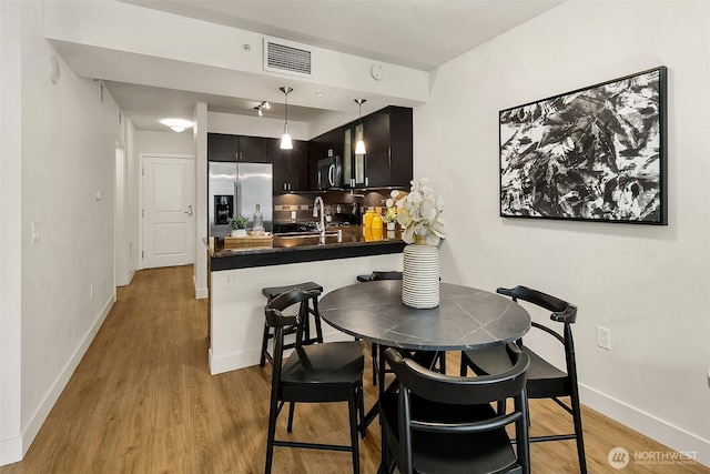819 Virginia St Unit 1606, Seattle, WA 98101 - dining room with light wood-style floors and baseboards