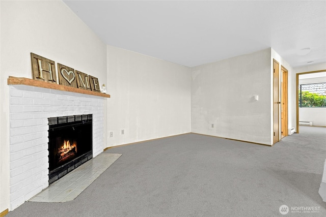 17521 118th Ave SE Unit A-4, Renton, WA 98058 - unfurnished living room featuring carpet and a brick fireplace