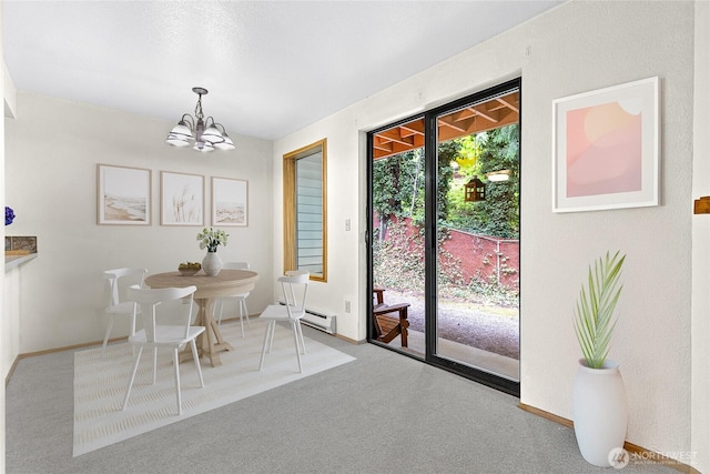 17521 118th Ave SE Unit A-4, Renton, WA 98058 - carpeted dining area with a chandelier and a baseboard radiator