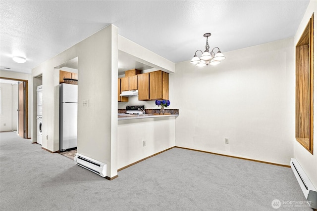 17521 118th Ave SE Unit A-4, Renton, WA 98058 - kitchen with baseboard heating, a baseboard radiator, freestanding refrigerator, under cabinet range hood, and light carpet