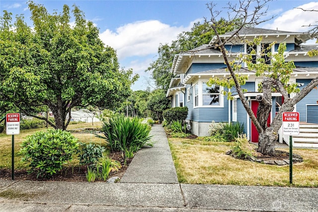 231 E 1st St, Port Angeles, WA 98362 - view of front of property with a shingled roof and a front yard