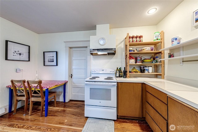 231 E 1st St, Port Angeles, WA 98362 - kitchen with white range with electric stovetop, light wood finished floors, light countertops, range hood, and brown cabinets
