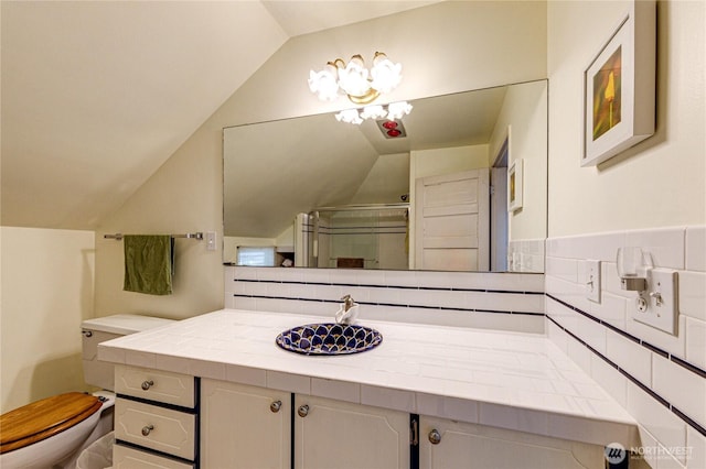 231 E 1st St, Port Angeles, WA 98362 - bathroom with lofted ceiling, a stall shower, and vanity