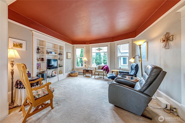 231 E 1st St, Port Angeles, WA 98362 - carpeted living area featuring built in features and ornamental molding