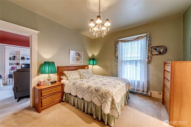 231 E 1st St, Port Angeles, WA 98362 - bedroom featuring light colored carpet, a chandelier, and a baseboard radiator