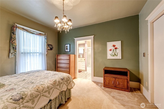 231 E 1st St, Port Angeles, WA 98362 - carpeted bedroom featuring a chandelier and ensuite bath
