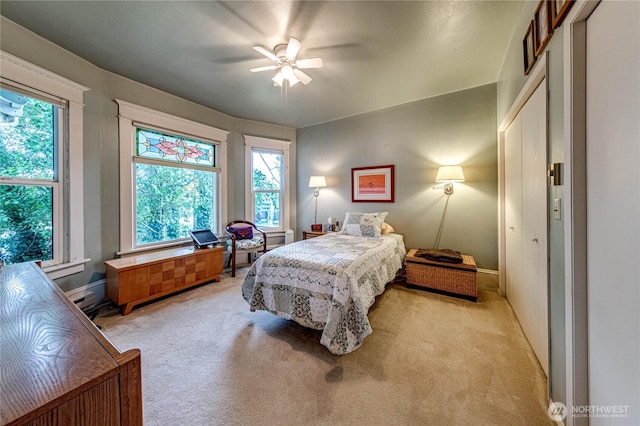 231 E 1st St, Port Angeles, WA 98362 - bedroom with light carpet, multiple windows, and ceiling fan