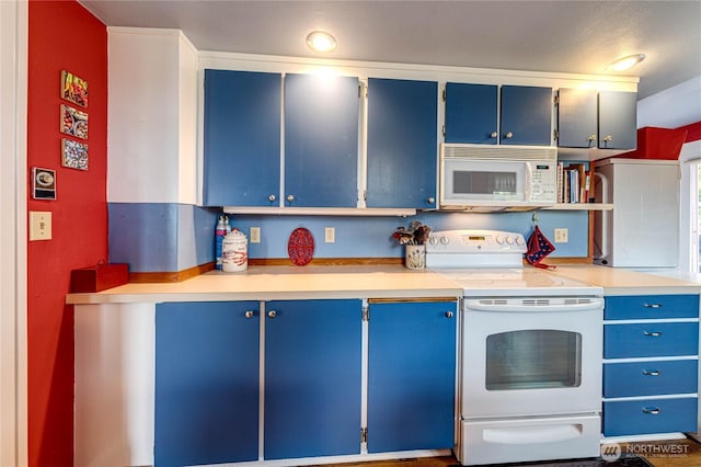 231 E 1st St, Port Angeles, WA 98362 - kitchen featuring blue cabinets, white appliances, and light countertops