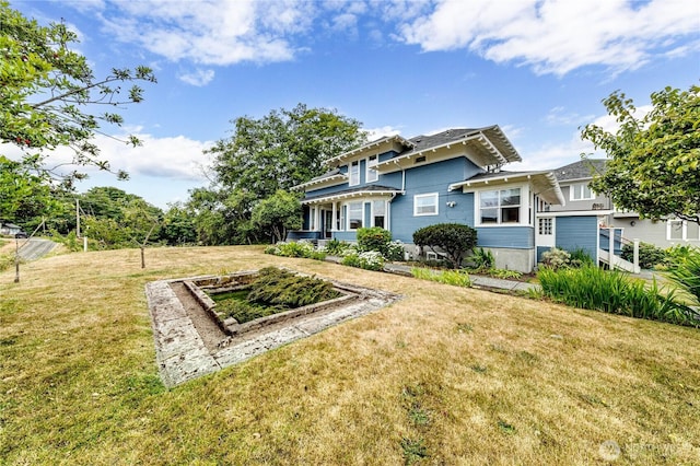 231 E 1st St, Port Angeles, WA 98362 - rear view of property featuring a lawn