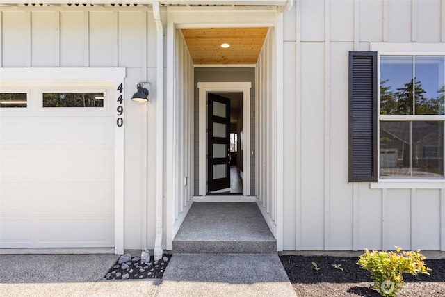 4490 Albatross St, Port Townsend, WA 98368 - doorway to property with board and batten siding and a garage