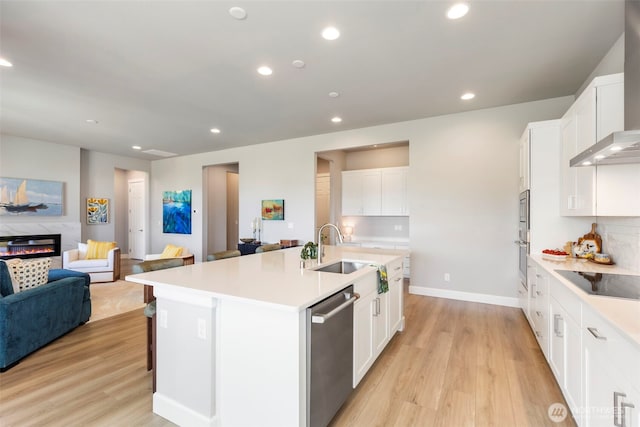 4490 Albatross St, Port Townsend, WA 98368 - kitchen with dishwasher, black electric stovetop, wall chimney range hood, open floor plan, and recessed lighting