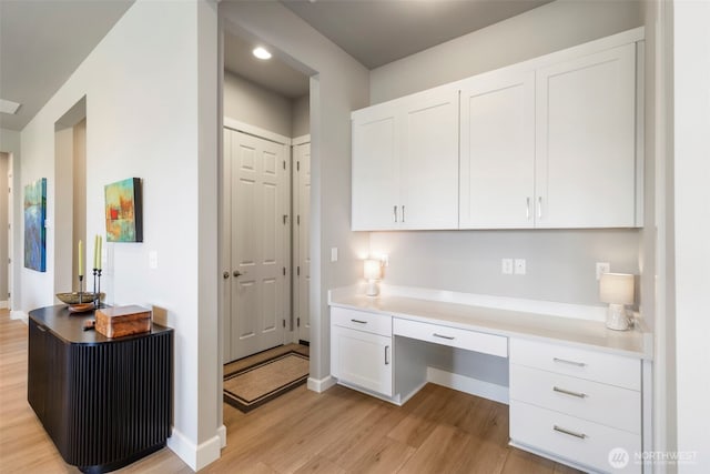 4490 Albatross St, Port Townsend, WA 98368 - home office featuring built in study area, light wood-style flooring, and recessed lighting