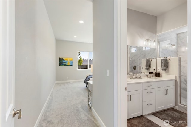 4490 Albatross St, Port Townsend, WA 98368 - bathroom with double vanity, a marble finish shower, and recessed lighting