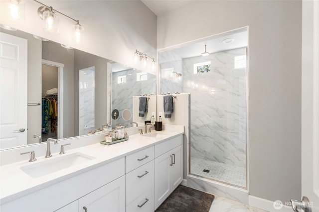 4490 Albatross St, Port Townsend, WA 98368 - full bathroom featuring marble finish flooring, a marble finish shower, double vanity, and a spacious closet