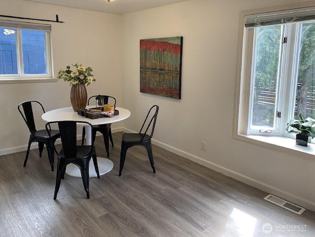 5910 21st Ave SW, Seattle, WA 98106 - dining area featuring wood finished floors and baseboards