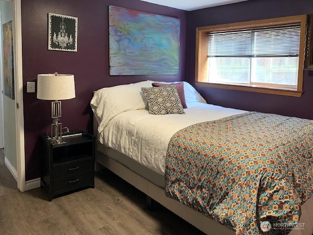 5910 21st Ave SW, Seattle, WA 98106 - bedroom featuring wood finished floors and baseboards