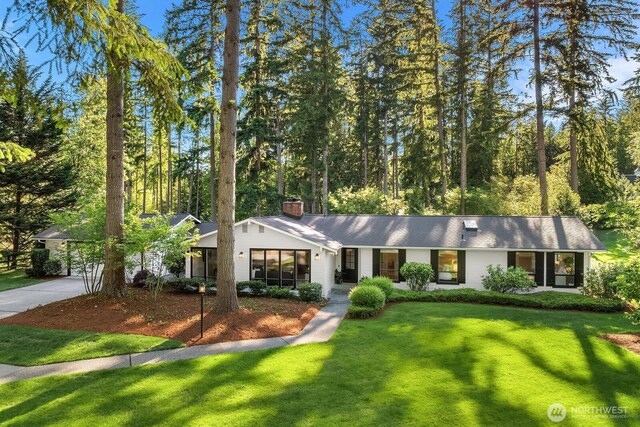 23350 SE 22nd St, Sammamish, WA 98075 - ranch-style home featuring a chimney, driveway, a front yard, and a garage